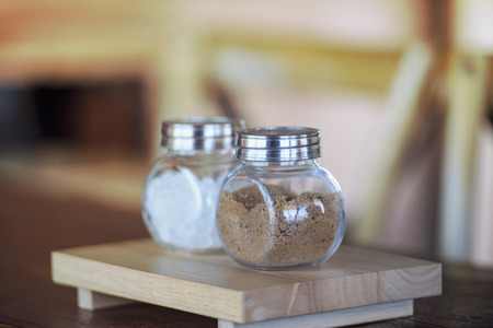 Sugar for coffee in a glass jar with a natural background.の写真素材