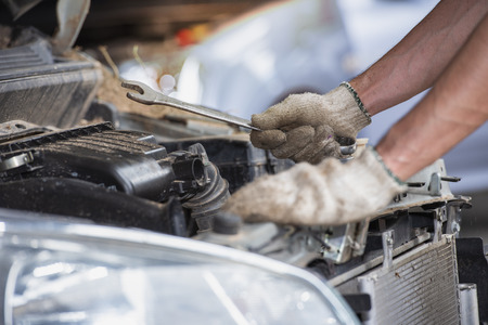 Mechanic Car Service in automobile garage auto car and vehicles service mechanical engineering.Auto mechanic working in garage. Repair service, Automobile mechanic repairs automotive service center.の写真素材