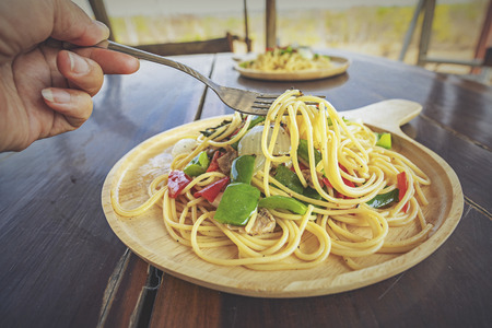 Spaghetti. Tomato sauce and vegetables.Tasty Appetizing classic Italian spaghetti pasta with tomato sauce and vegetable.の写真素材