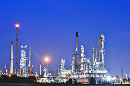 Oil and gas industry storage tank and pipeline steel,Oil refinery plant at twilight with sky in night time background.Refinery at sunset,Oil Refinery and Petrochemical plant.の写真素材