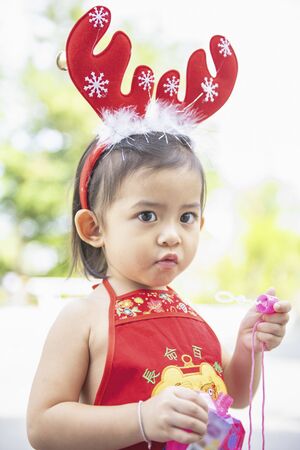 Cute little Asian girl is enjoying at the playground.の写真素材