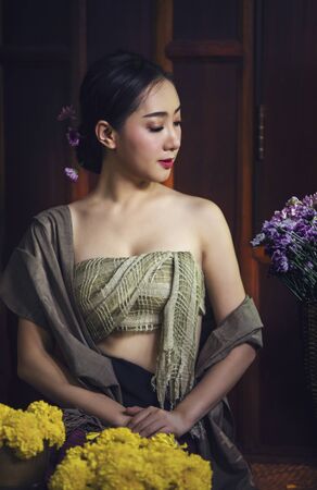 Thailand traditional dress,Beautiful Thai girl in traditional dress costume,woman wearing typical Thai dress,identity culture of thailand.の写真素材
