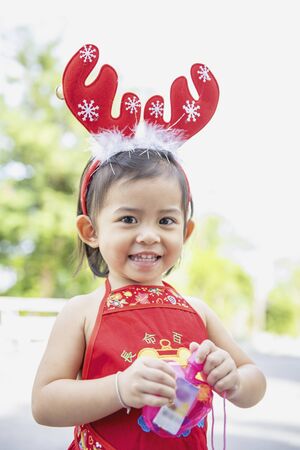 Cute little Asian girl is enjoying at the playground.の写真素材