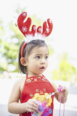 Cute little Asian girl is enjoying at the playground.の写真素材