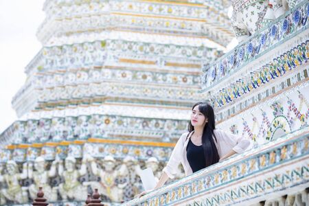 Beautiful Lao girl tourists visiting Thai temples,Bangkok,Thailand.の写真素材