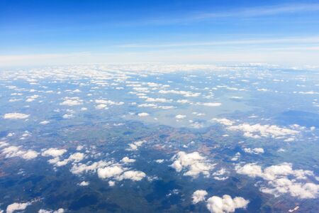 Aerial view of mountains, rivers, clouds, Agricultural Landscape areas the green and yellow rice field, Aerial view of grew in different pattern, And housing.Remote viewing.の写真素材