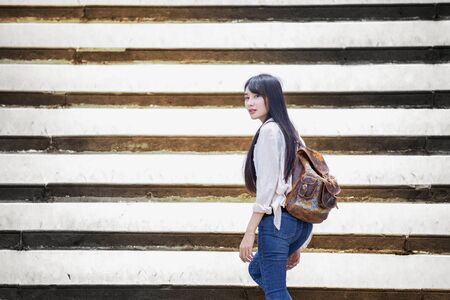 Beautiful Lao girl tourists visiting Thai temples,Bangkok,Thailand.の写真素材