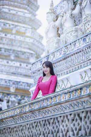 Beautiful Lao girl tourists visiting Thai temples,Bangkok,Thailand.の写真素材
