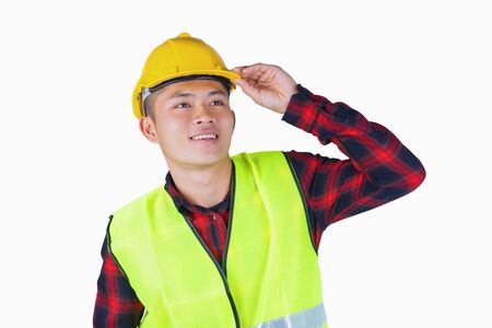 Portrait of young handsome engineer with safety helmet reflective vest.