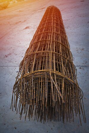 Steel rod, Reinforcement of concrete with metal rods connected by wire. Reinforcement metal framework for concrete pouring. Ready for filling up with concrete.の写真素材