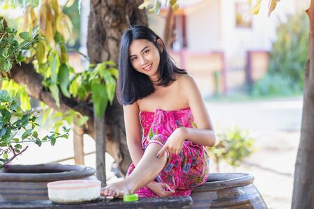 Beautiful women bath using soap that contains natural ingredients.Young woman using bar of natural soap.の写真素材