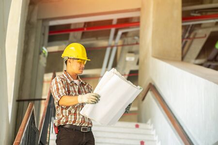 Engineer is working on a job site. Engineering as a whole and the working cap. He inspected the new...