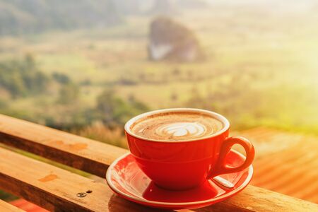 Cup of coffee on wooden table background.の写真素材