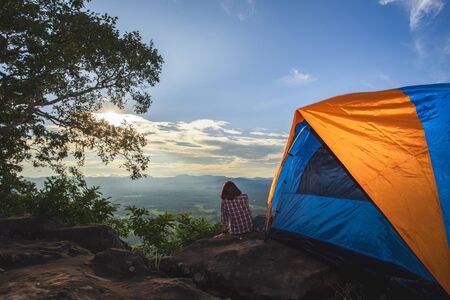 Tourists pitch a tent on the cliff to see the beauty of the sunrise and sunset.の写真素材