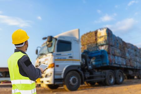 Foreman controls the recycle waste separation of recyclable waste plants. Waste plastic bottles and other types of plastic waste.の写真素材