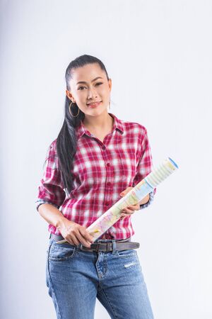 Beautiful young working women grinning professional in office confident expression. A confident young woman is checking the job. Have the opportunity to work everywhere.の写真素材