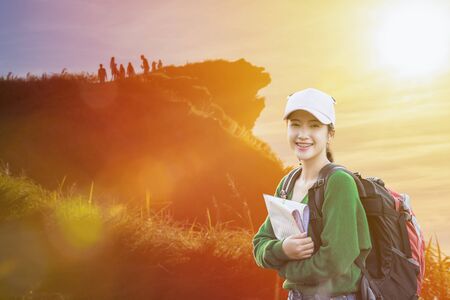 Travelers and traveling to nature. Hipster young travelers with backpack enjoying nature of mountain. Adventurer hiker looking beautiful nature.の写真素材