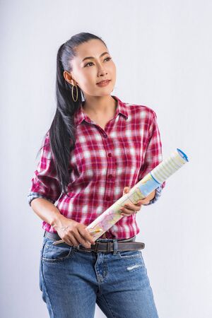 Beautiful young working women grinning professional in office confident expression. A confident young woman is checking the job. Have the opportunity to work everywhere.の写真素材