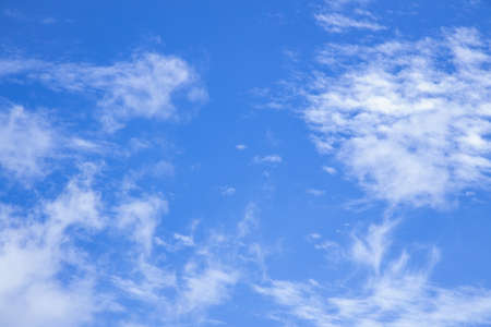 Soft white clouds against blue sky. Blue sky with beautiful natural white clouds.の写真素材