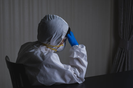 Doctors wear a face shield / PPE for protection against coronavirus disease. The doctor recommends using alcohol to clean to kill the coronavirus.の写真素材