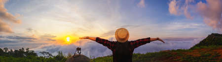 Foggy layered mountain landscape, Beautiful landscape of the mountain in front of with sea of fog in thailand. Tourists taking photos with fog. Panoramicの写真素材