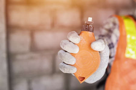 Construction worker, Worker with tool over construction background.