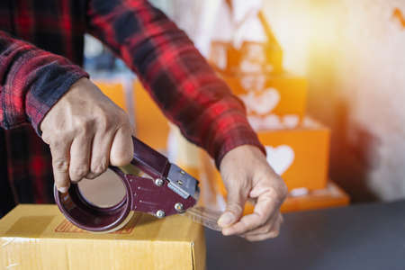 Packing,Online small business owner. Online Shopping and Express Delivery theme. Sales of the internet.の写真素材
