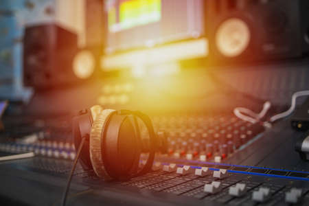 Recording room,Compression room, Music on sound mixer in recording studio.Close Up Shot of Audio Producer Working in Music Recording Studio, Uses Mixing Board Create Modern Song. Sound recording room.の写真素材