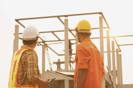 The foreman is inspecting the construction site.の写真素材