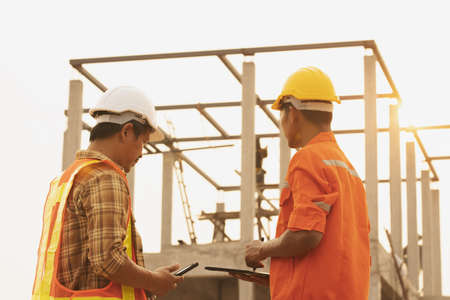 The foreman is inspecting the construction site.の写真素材