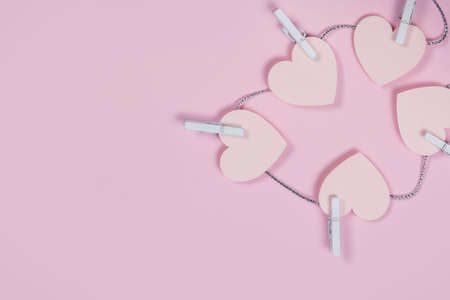 Pink hearts from paper scattered on pink background love wedding concept. Valentines day background....