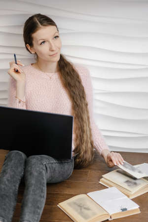 Learning at home, online learning, self quarantine concept. Student woman at home. Girl looks...