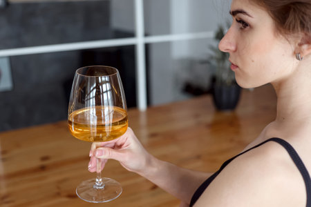 Cute woman enjoying glass of white wine. Copy space, background, negative space for text overlay, real people, human element, summer, toast, drinks, cocktails, celebration, cheers drinkingの写真素材