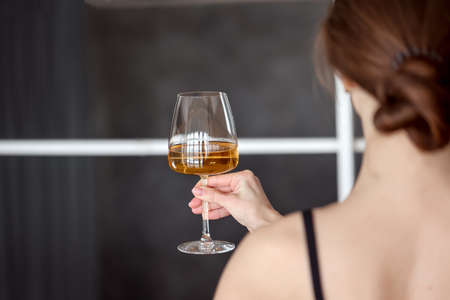 Cute woman enjoying glass of white wine. Copy space, background, negative space for text overlay, real people, human element, summer, toast, drinks, cocktails, celebration, cheers drinkingの写真素材