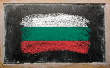 Chalky bulgarian flag painted with color chalk on old blackboardの写真素材