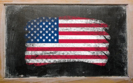 Chalky united states of america flag painted with color chalk on old blackboardの写真素材