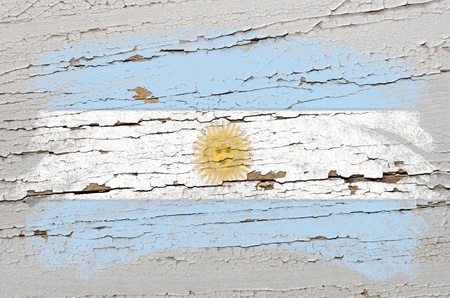 Chalky argentinian flag painted with color chalk on grunge wooden textureの写真素材