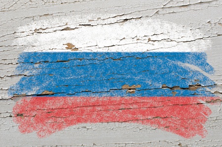 Chalky russian flag painted with color chalk on grunge wooden textureの写真素材