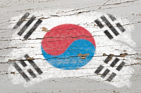 Chalky south korean flag painted with color chalk on grunge wooden textureの写真素材
