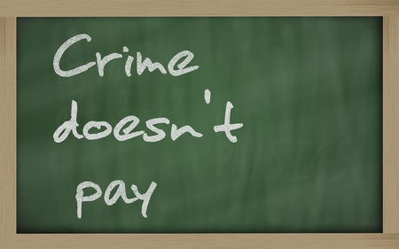 Blackboard writings " Crime doesn't pay "の写真素材
