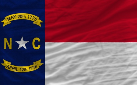 complete flag of us state of north carolina covers whole frame, waved, crunched and very natural looking. It is perfect for backgroundの写真素材