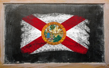 Chalky american state of florida flag painted with color chalk on old blackboardの写真素材