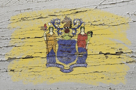 Chalky american state of new jersey flag precisely painted with color chalk on grunge wooden textureの写真素材