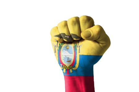 Low key picture of a fist painted in colors of ecuador flagのeditorial素材