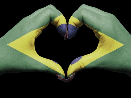 Gesture made by brazil flag colored hands showing symbol of heart and loveの写真素材