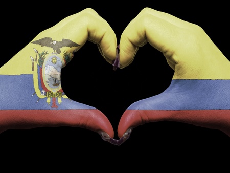 Gesture made by ecuador flag colored hands showing symbol of heart and loveの写真素材