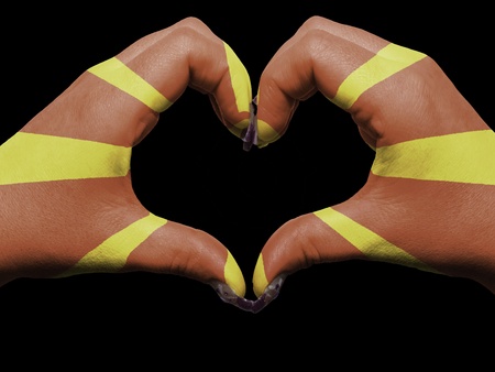 Gesture made by macedonia flag colored hands showing symbol of heart and love の写真素材