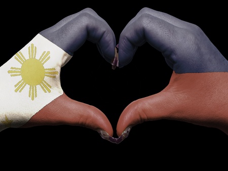 Tourist made gesture  by philippines flag colored hands showing symbol of heart and love の写真素材