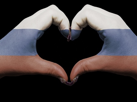 Gesture made by russia flag colored hands showing symbol of heart and love の写真素材