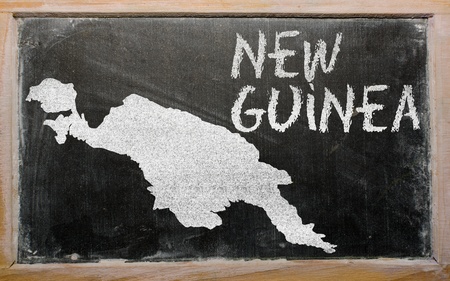 drawing of new guinea on blackboard, drawn by chalkの写真素材